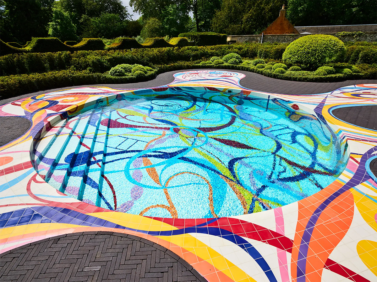 Awe-Inspiring Swimming Pools with vibrant tiled lines and curves swooping through the surface of the pool. 