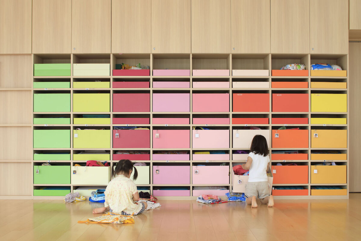 A primary school classroom wall with colorblocked storage. 