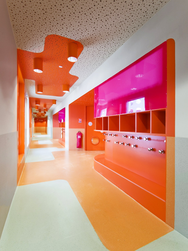 An orange and pink hallway featuring storage. 