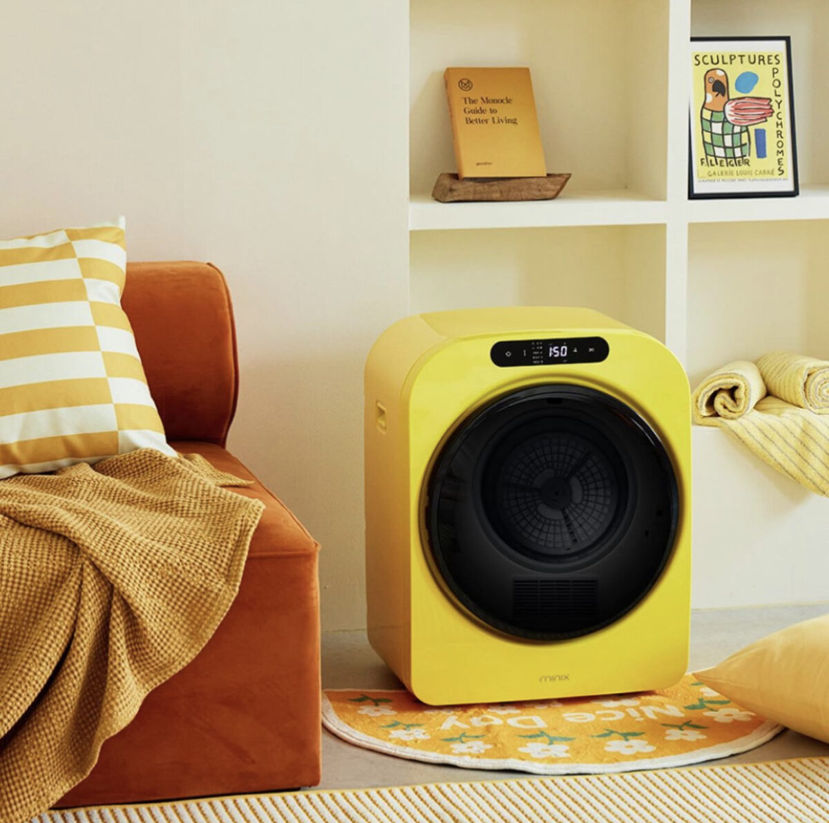 A bright yellow mini washing machine. 
